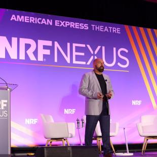 Alex Genov speaking at NRF Nexus 2023.