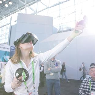 An individual sampling new technology at Retail's Big Show.