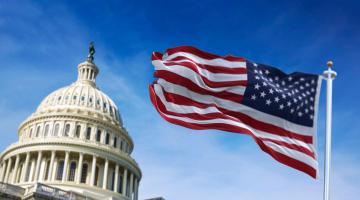 The United States Capitol and American flag. 