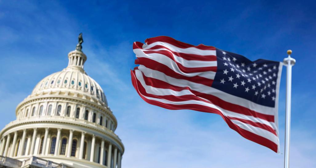 The United States Capitol and American flag.