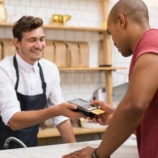 Shopper paying with a credit card.