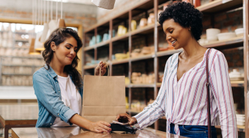 Shopper paying with a credit card. 