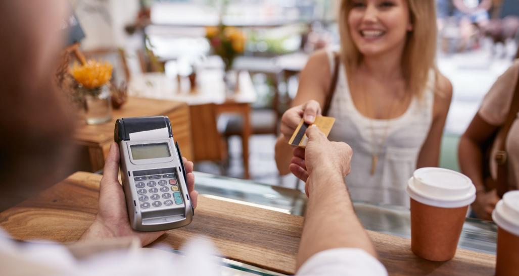 A Shopper paying with their credit card.