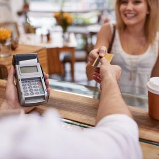 A Shopper paying with their credit card.