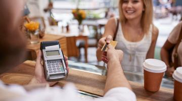 A Shopper paying with their credit card.