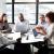 A corporate meeting amongst diverse individuals.