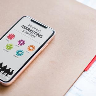 a phone with inbound marketing on the screen