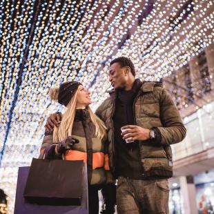 A couple shops during the holidays