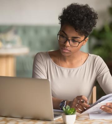 Woman works at laptop