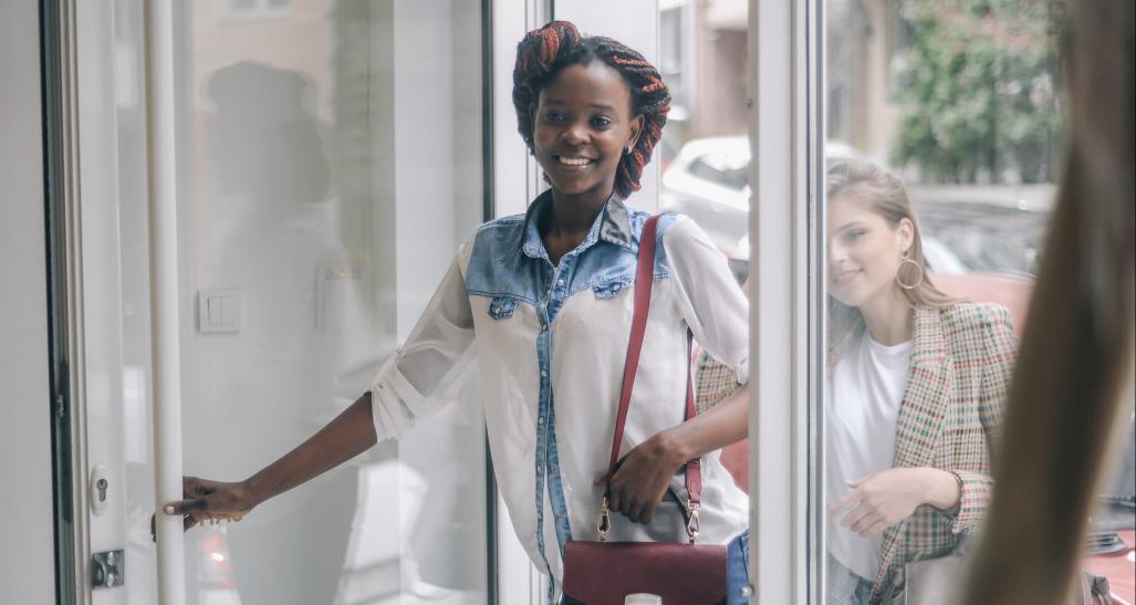 Two women enter a retail shop