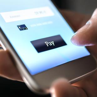 Man pays for something with mobile phone
