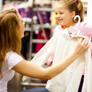 Mother and child shopping for clothes