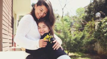Child hugs mother