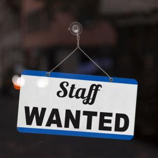 Staff wanted sign on door.