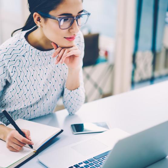 Woman works at laptop