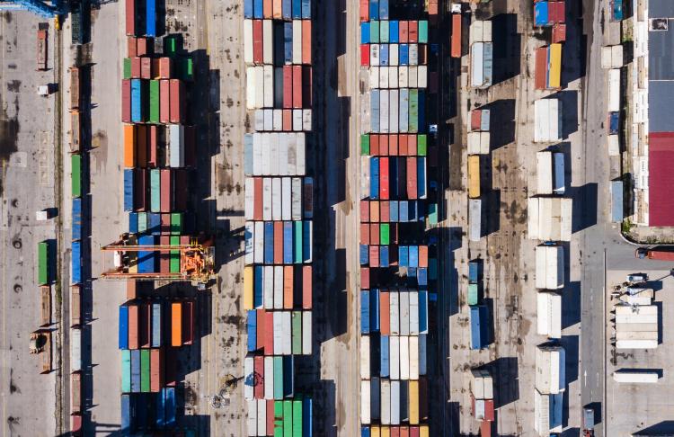 an aerial of shipment trucks at a port
