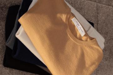 A stack of Ralph Lauren folded sweaters.