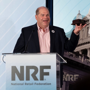 Neil Abramson receiving the America's Retail Champion award.