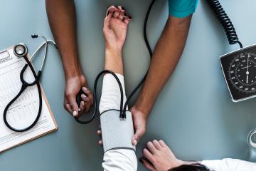 Nurse taking blood pressure