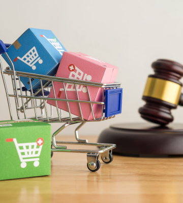 A shopping cart and gavel symbolizing retail law.