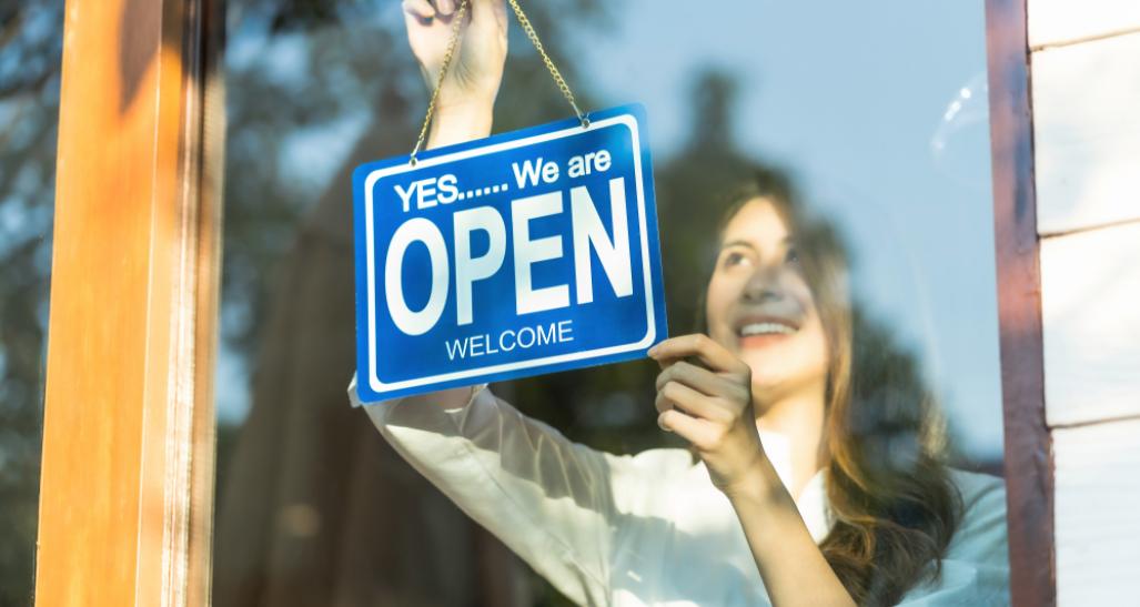 Worker with open sign