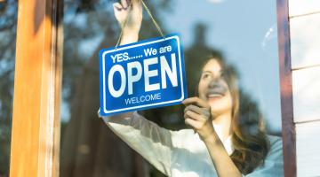 Worker with open sign