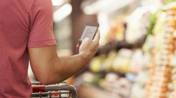 Man using phone in store