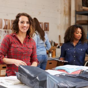 Retail workers packaging orders