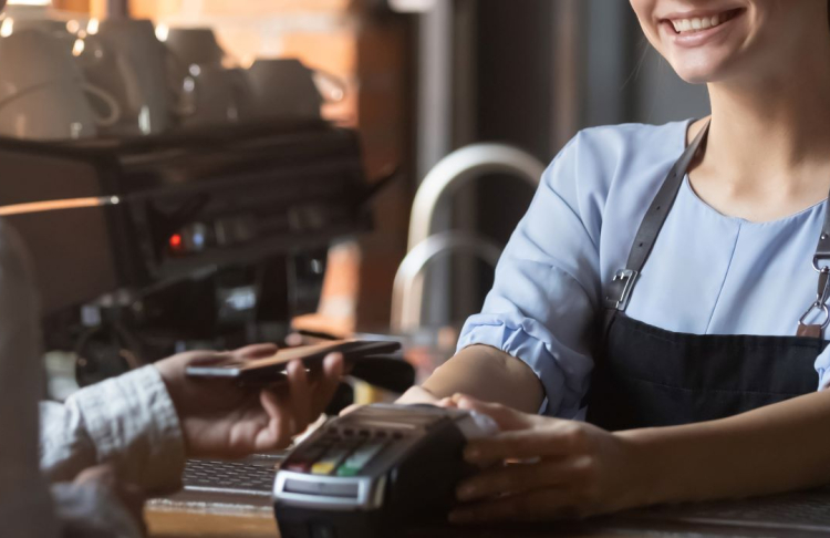 Customer paying for goods with a credit card. 