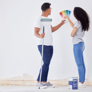Couple working on home improvement.