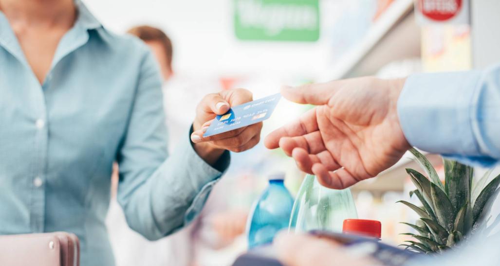 Woman pays with credit card