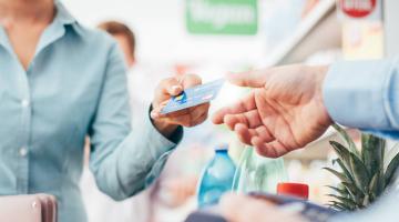 Woman pays with credit card