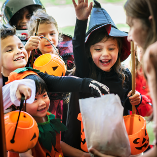 trick or treaters getting candy on Halloweed